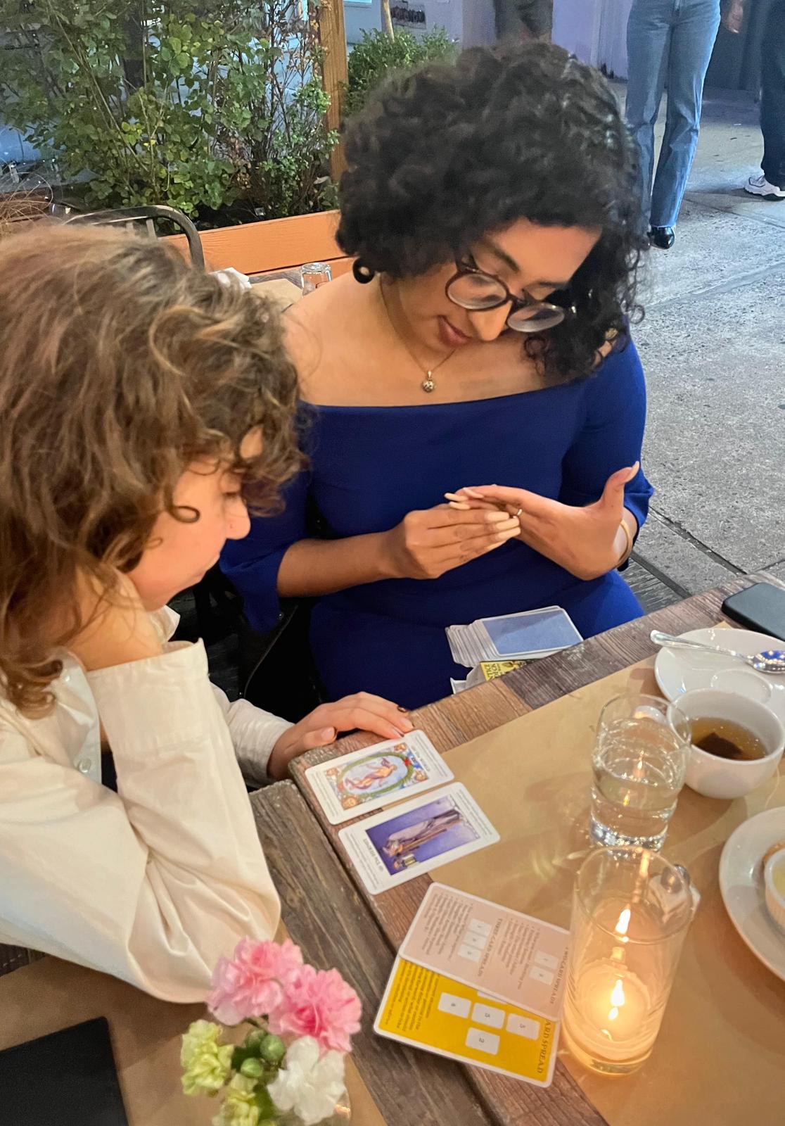 Mini conducting an outdoor tarot reading